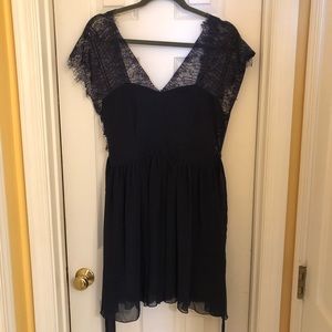 Deep purple cocktail dress with lace details
